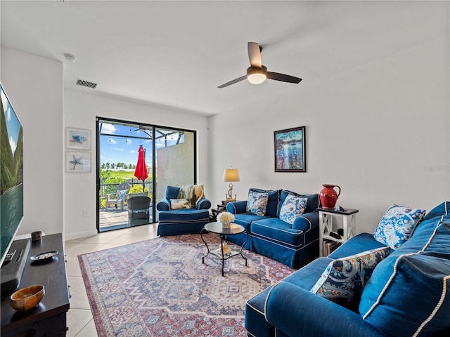 living room featuring ceiling fan and light tile patterned floors