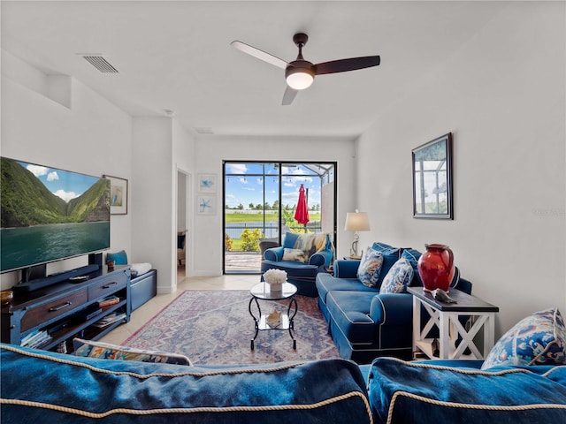 tiled living area featuring visible vents and ceiling fan