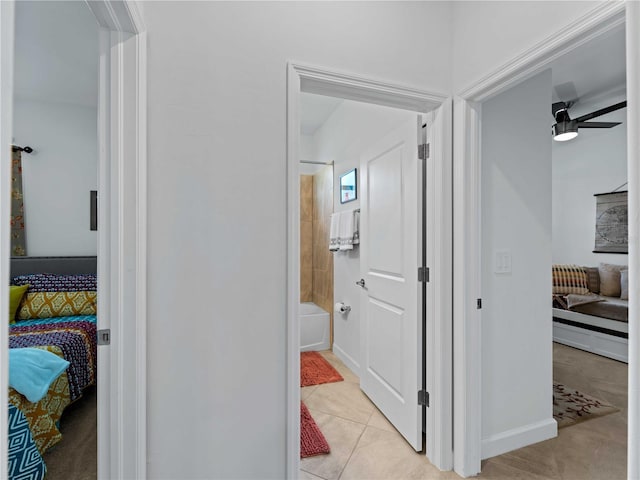 hall with light tile patterned flooring