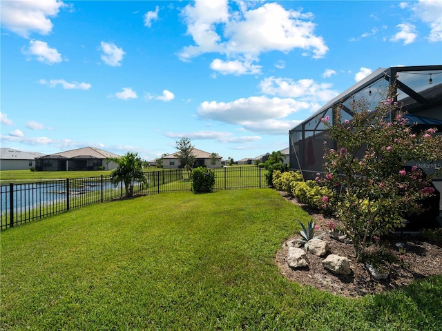 view of yard featuring a lanai and a fenced backyard