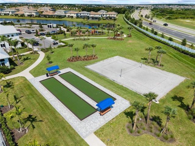 drone / aerial view with a residential view and a water view