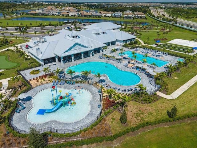 bird's eye view featuring a water view and a residential view