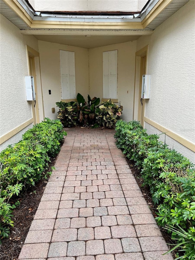 view of exterior entry with stucco siding