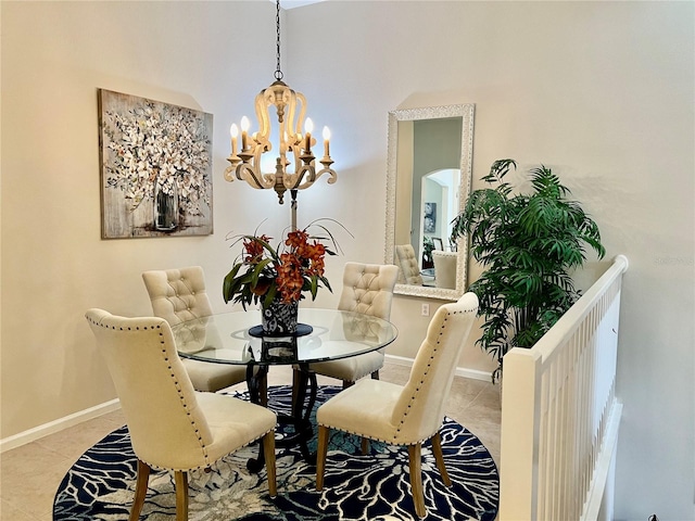 dining space featuring light tile patterned flooring and a notable chandelier