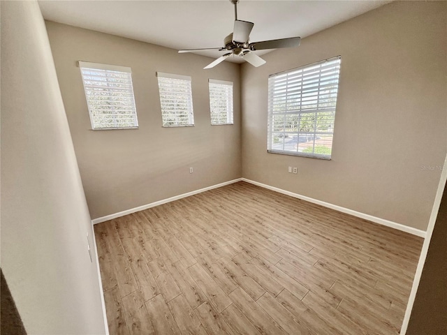 unfurnished room with ceiling fan and light hardwood / wood-style floors