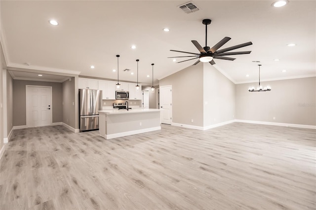 unfurnished living room featuring light wood finished floors, visible vents, vaulted ceiling, and ornamental molding