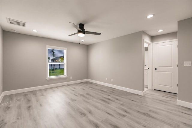 spare room with ceiling fan and light hardwood / wood-style flooring