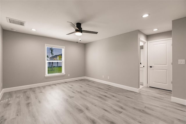 spare room with baseboards, visible vents, a ceiling fan, light wood-style flooring, and recessed lighting