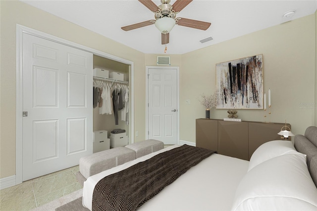 bedroom with a closet, ceiling fan, and light tile patterned flooring