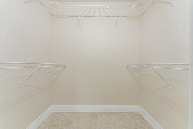 walk in closet featuring tile patterned floors