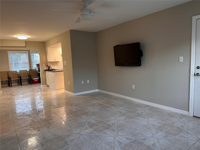 tiled living room featuring ceiling fan