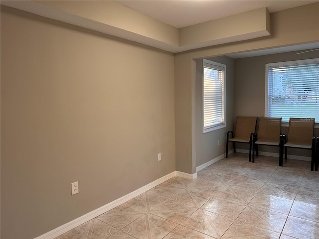 empty room with light tile patterned flooring