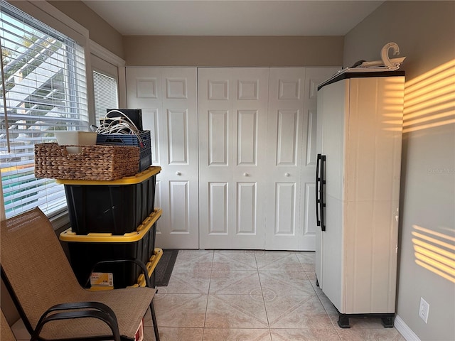 interior space with light tile patterned floors