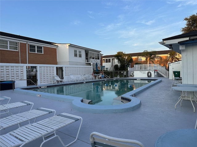 view of swimming pool featuring a patio area