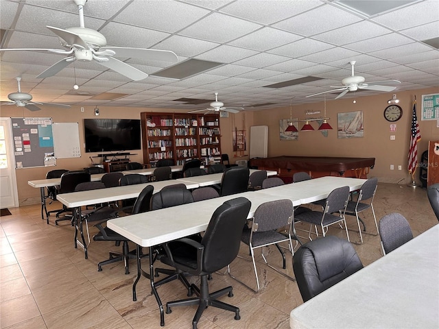 dining room featuring a drop ceiling, ceiling fan, and light tile patterned floors