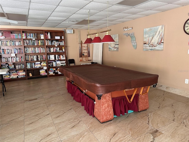 game room with a drop ceiling, pool table, and tile patterned floors