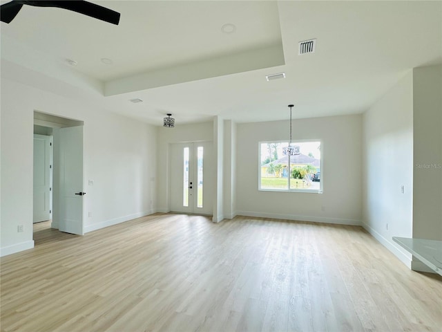 spare room with light hardwood / wood-style floors