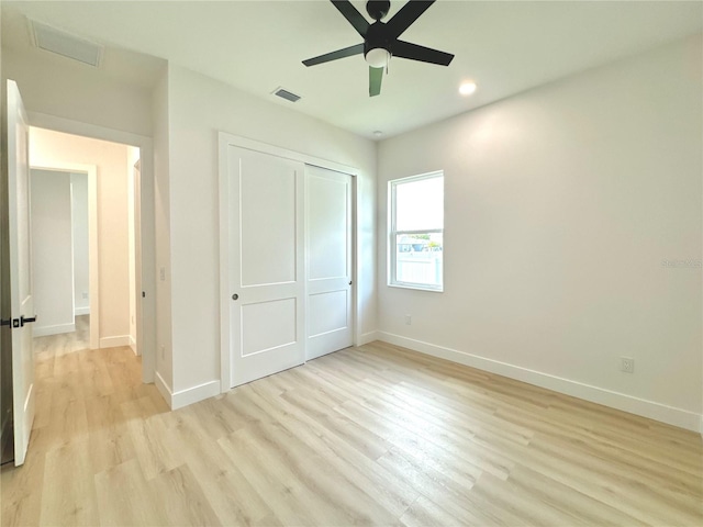 unfurnished bedroom featuring a closet, ceiling fan, and light hardwood / wood-style floors