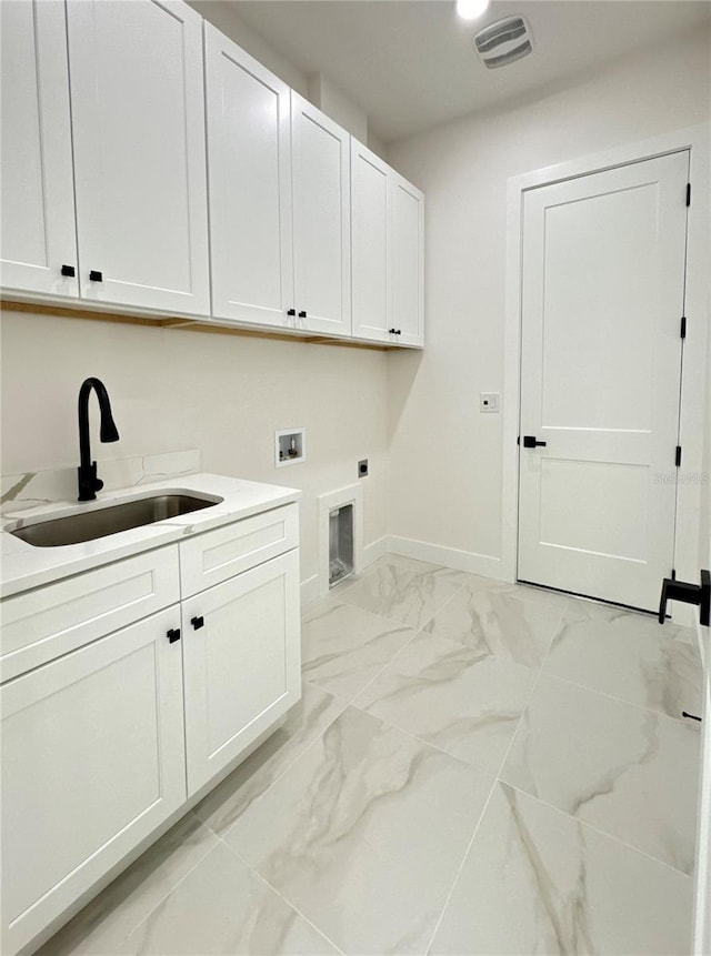 clothes washing area with cabinets, electric dryer hookup, sink, and washer hookup