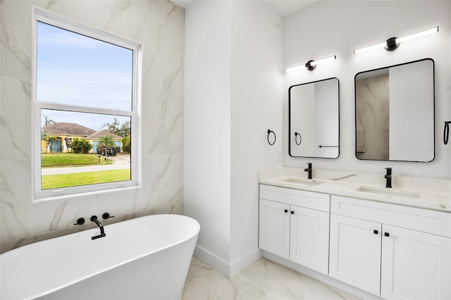 bathroom with a bathtub and vanity