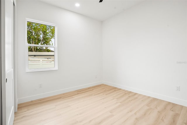 unfurnished room with light wood-type flooring