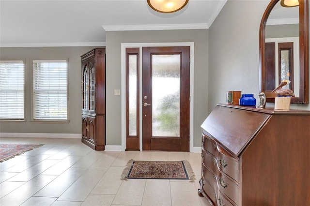 foyer featuring crown molding and light tile patterned flooring