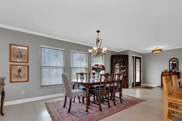 tiled dining area with crown molding and an inviting chandelier