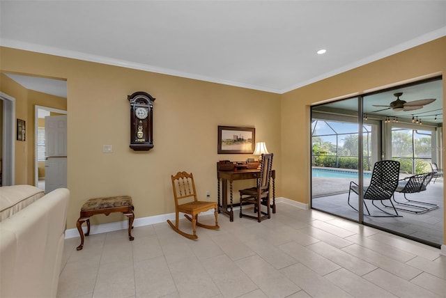 living area featuring ceiling fan, light tile patterned flooring, and ornamental molding