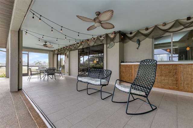 sunroom / solarium with ceiling fan