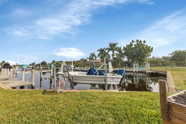 dock area featuring a yard and a water view