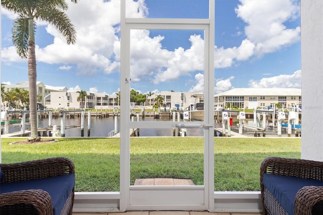 sunroom with a water view and a healthy amount of sunlight