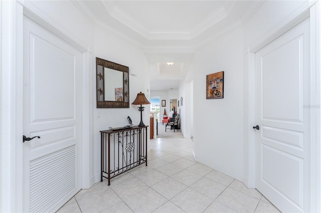 corridor featuring crown molding and light tile patterned flooring