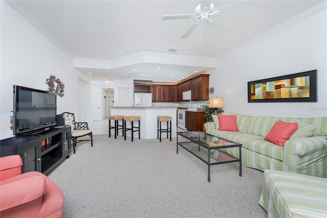 living room featuring crown molding, ceiling fan, and light colored carpet