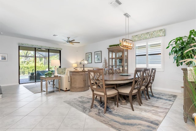 dining area featuring a healthy amount of sunlight, ceiling fan, and light tile patterned flooring