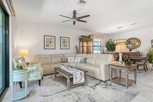 living room with light tile patterned flooring and ceiling fan