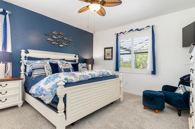 bedroom with ceiling fan and light colored carpet