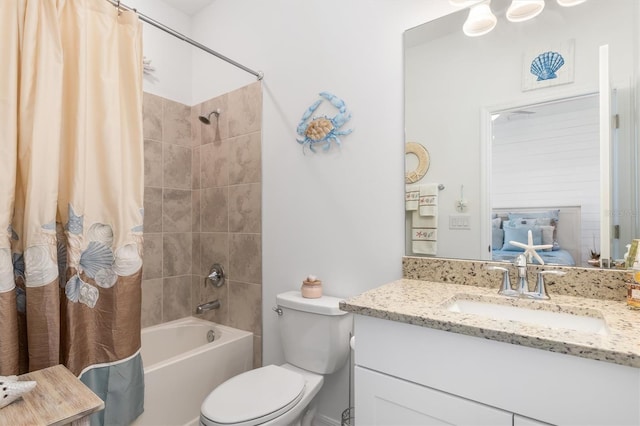 full bathroom with toilet, shower / tub combo with curtain, and vanity