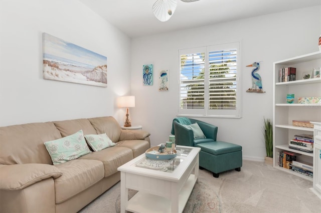 living room featuring ceiling fan and light carpet