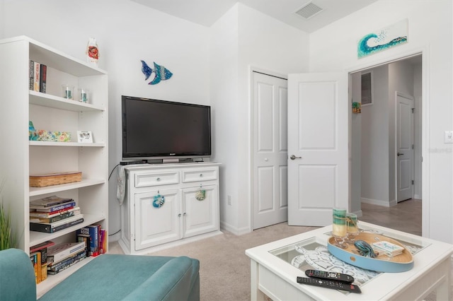 living room featuring light carpet