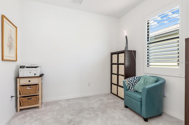 living area with light colored carpet