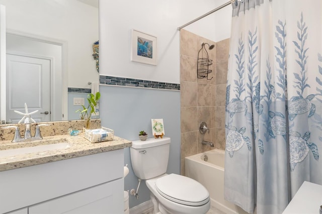 full bathroom featuring vanity, toilet, and shower / tub combo with curtain