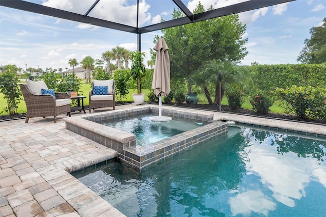 view of swimming pool with a patio and an in ground hot tub