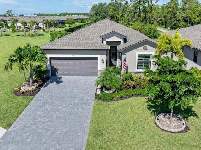 ranch-style home with a front yard and a garage