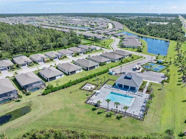 birds eye view of property with a water view