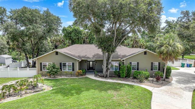 ranch-style home with a front yard