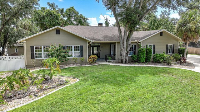 ranch-style house with a front lawn