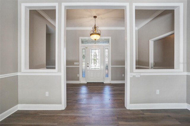 foyer featuring dark hardwood / wood-style flooring and crown molding