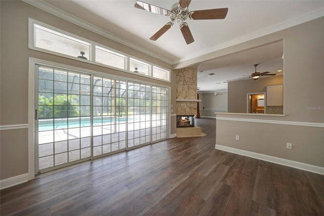 unfurnished room featuring dark wood-style floors, plenty of natural light, and crown molding