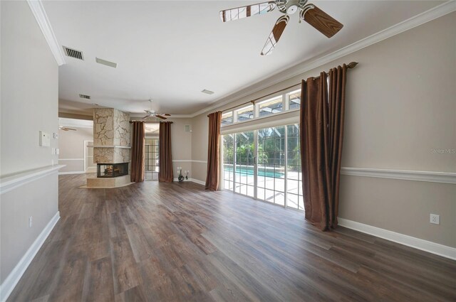 unfurnished living room featuring ceiling fan, dark hardwood / wood-style floors, and a fireplace