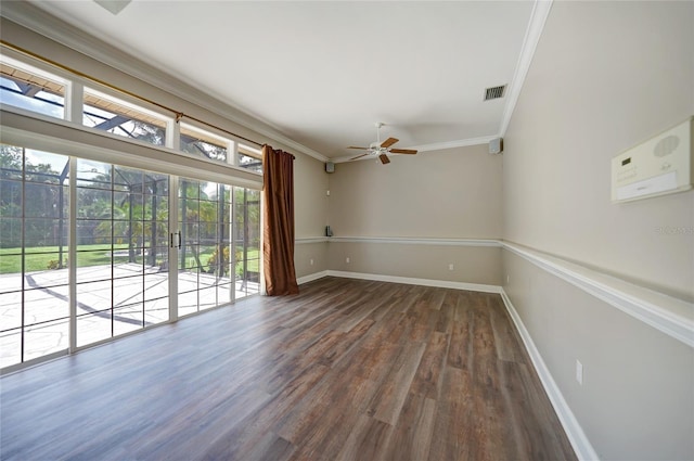 empty room with ceiling fan, dark wood-type flooring, visible vents, baseboards, and crown molding